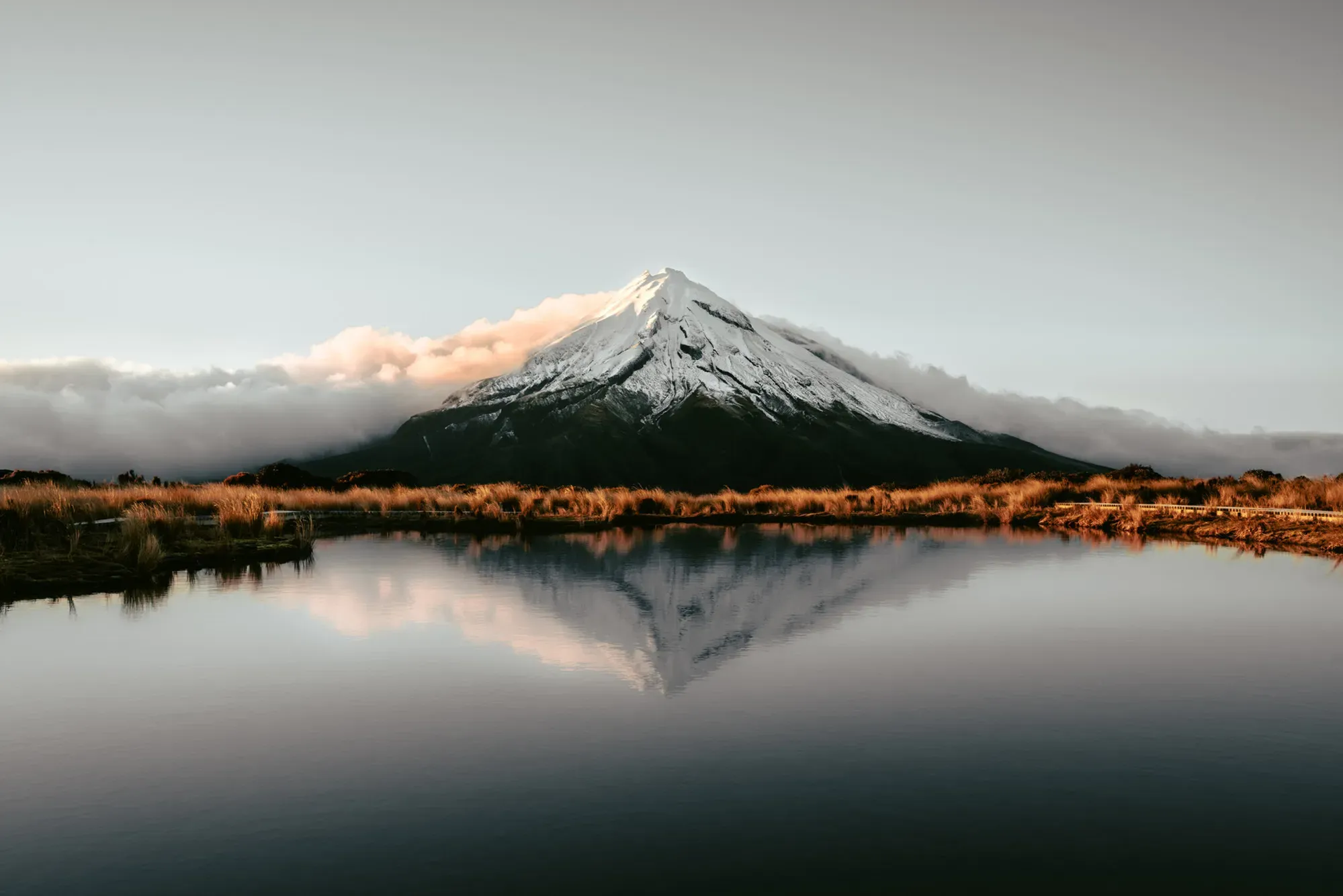Mount Taranaki reflected in the Pouakai reflective tarn at sunrise